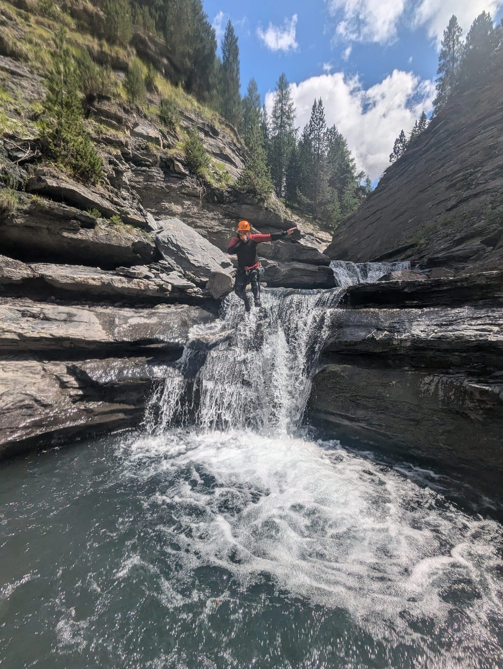 Group in a waterfall of the Clapouse canyon, Ubaye valley
